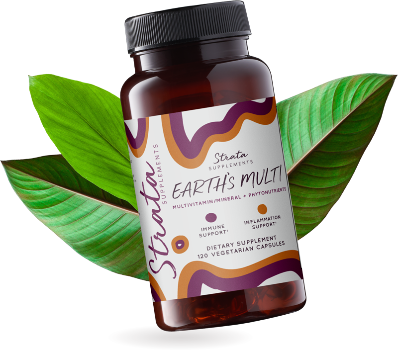 Bottle of Earth's Multi multivitamin tilted with leaves around it